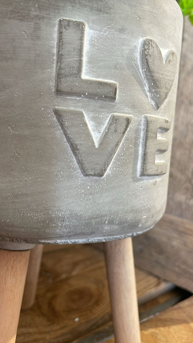 Parlane concrete flowerpot on legs 'LOVE'